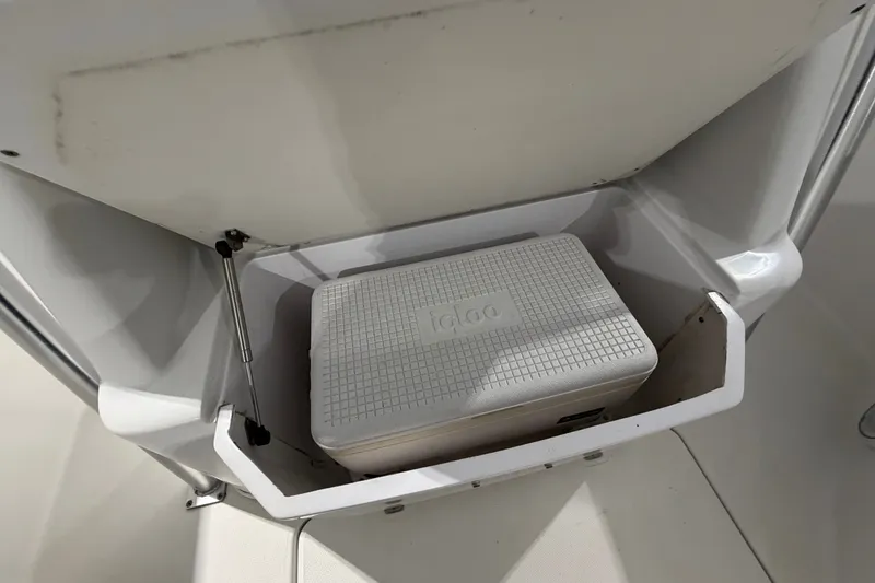 Slide: The Image of Storage compartment with cooler on a 2007 Donzi 29 ZF Cuddy boat. - 17
