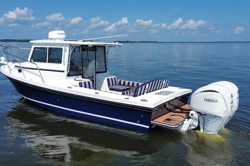 Slide: The Image of 2026 Steiger Craft 28 Annapolis boat with Yamaha engine on calm water. - 3