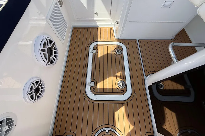Slide: The Image of 2026 Steiger Craft 28 Annapolis boat deck with wood finish and built-in speakers. - 27