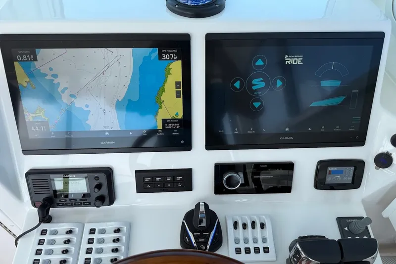 Slide: The Image of Steiger Craft 28 Annapolis 2026 helm with dual Garmin displays and navigation controls. - 31