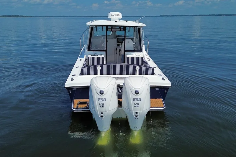 Slide: The Image of 2026 Steiger Craft 28 Annapolis boat with twin Yamaha 250 V6 engines on calm water. - 10