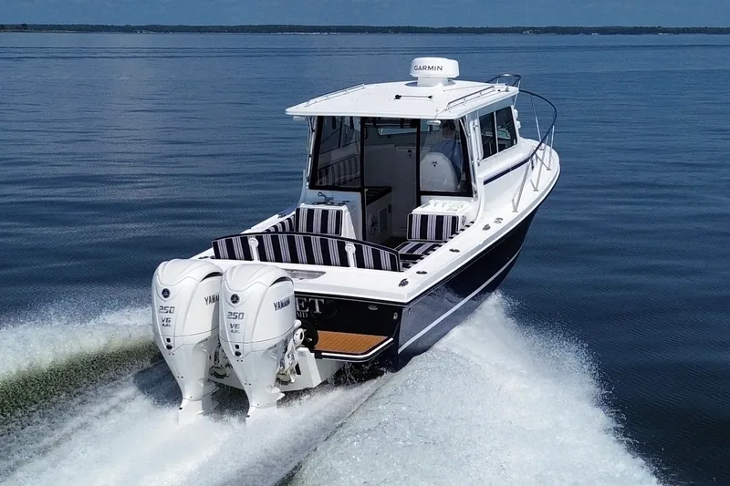 Slide: The Image of 2026 Steiger Craft 28 Annapolis boat cruising on calm water. - 13
