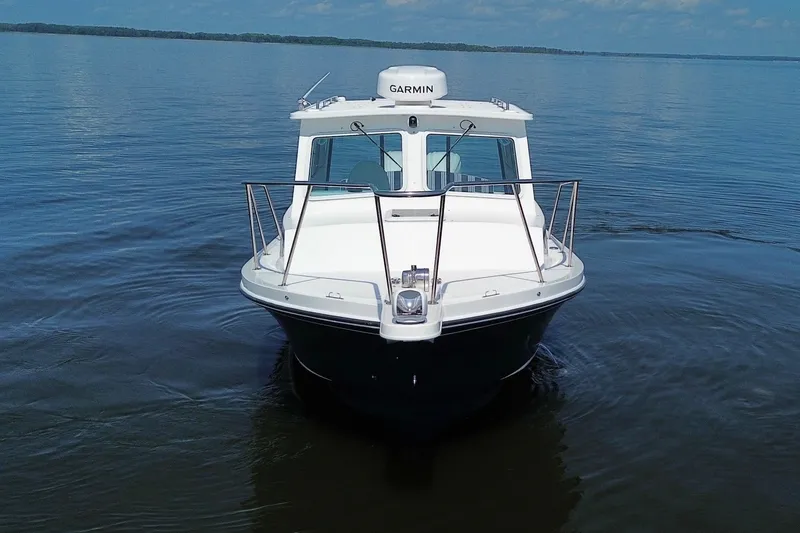 Slide: The Image of 2026 Steiger Craft 28 Annapolis boat on calm water, front view. - 4