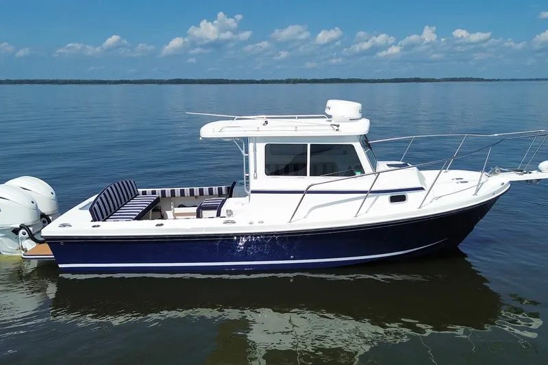 Slide: The Image of 2026 Steiger Craft 28 Annapolis boat on calm water, featuring sleek design and modern amenities. - 6