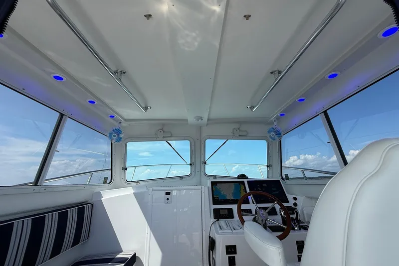 Slide: The Image of Interior of 2026 Steiger Craft 28 Annapolis boat with modern controls and seating. - 23