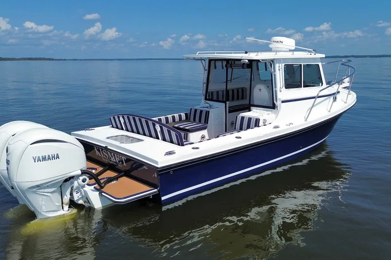 Slide: The Image of 2026 Steiger Craft 28 Annapolis boat with Yamaha engines on calm water. - 7