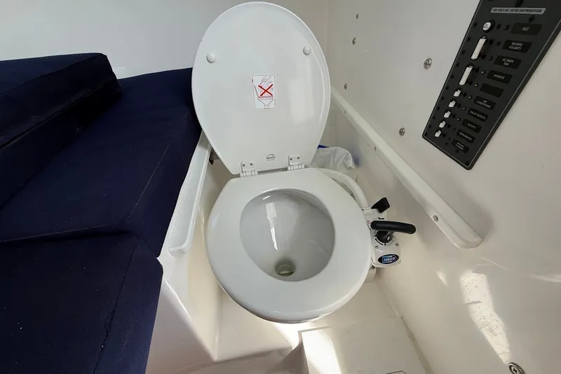 Slide: The Image of 2026 Steiger Craft 28 Annapolis boat interior with marine toilet and control panel. - 35