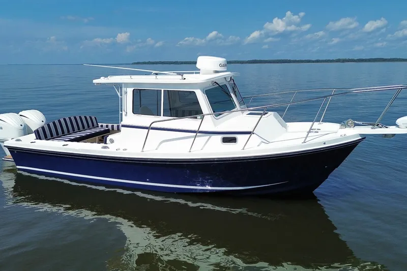 Slide: The Image of 2026 Steiger Craft 28 Annapolis boat on calm water, featuring sleek design and modern amenities. - 5