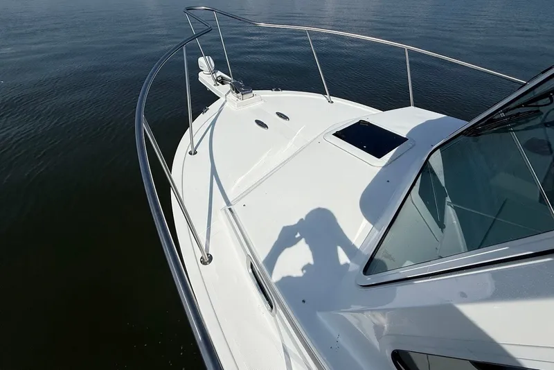 Slide: The Image of 2026 Steiger Craft 28 Annapolis boat deck with railing on calm water. - 36