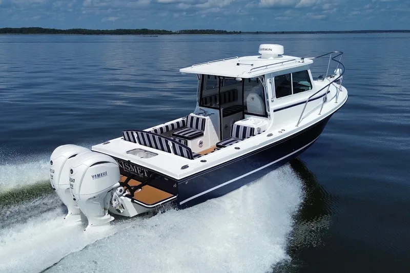 Slide: The Image of 2026 Steiger Craft 28 Annapolis boat cruising on calm water with twin Yamaha engines. - 12
