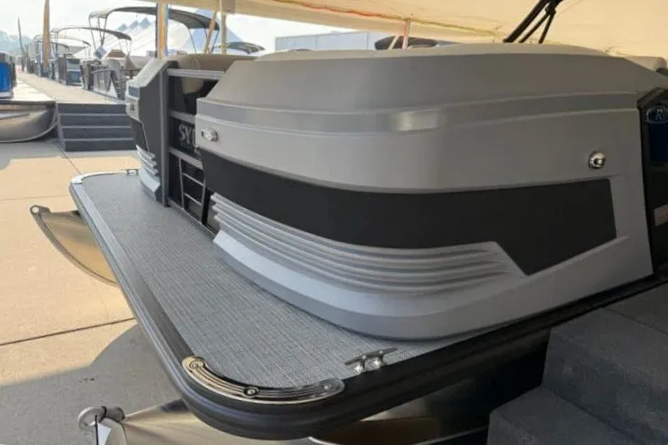 Slide: The Image of 2027 Sylvan R-20 PARTY FISH pontoon boat docked at marina. - 6