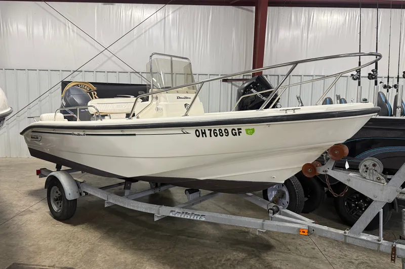The Image of 1999 Boston Whaler 160 Dauntless boat on trailer in indoor storage. - 0