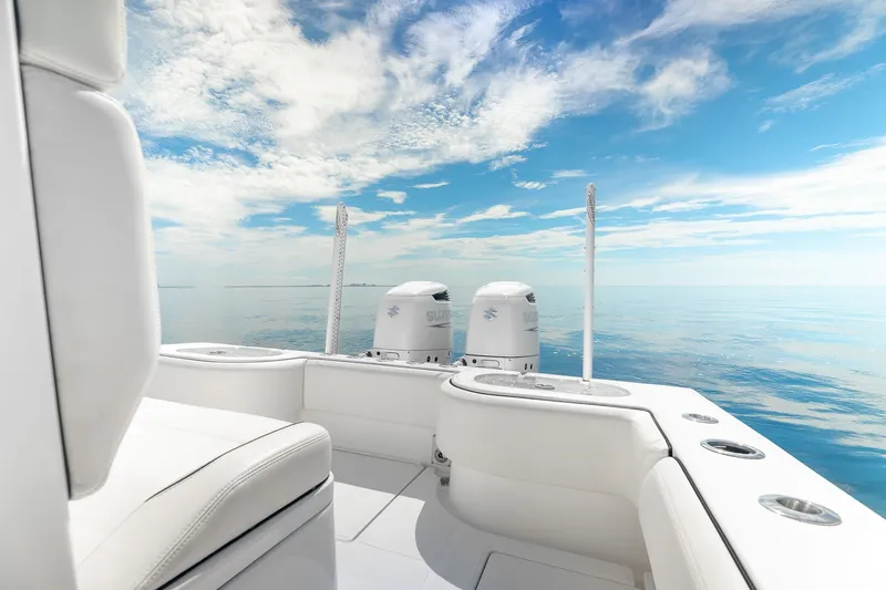 Slide: The Image of 2024 SeaHunter 28 Floridian boat on calm ocean under blue sky. - 18