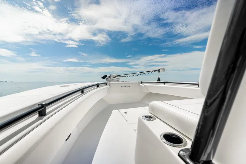 Slide: The Image of 2024 SeaHunter 28 Floridian boat deck under a clear blue sky. - 20