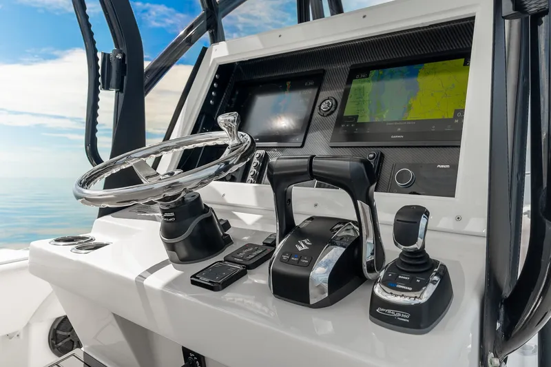 Slide: The Image of 2024 SeaHunter 28 Floridian boat dashboard with advanced navigation and control systems. - 16
