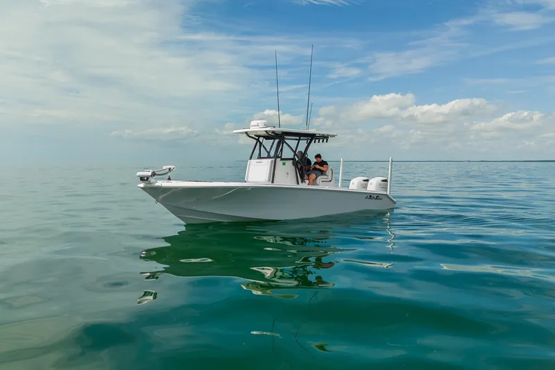 Slide: The Image of 2024 SeaHunter 28 Floridian boat on calm ocean waters under a clear sky. - 2