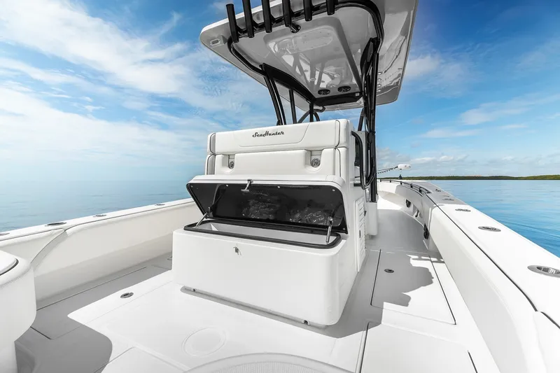 Slide: The Image of 2024 SeaHunter 28 Floridian boat interior with open storage, under clear blue sky. - 13