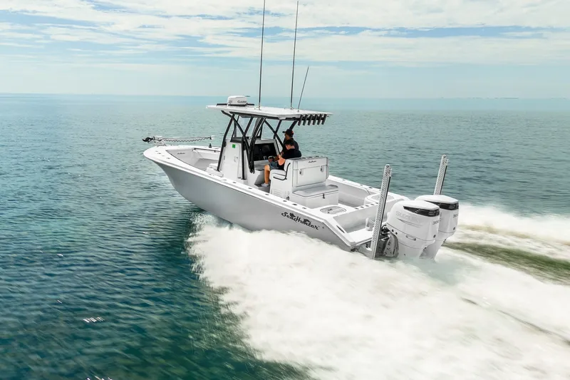 Slide: The Image of 2024 SeaHunter 28 Floridian boat cruising on open water, showcasing sleek design and powerful engines. - 5