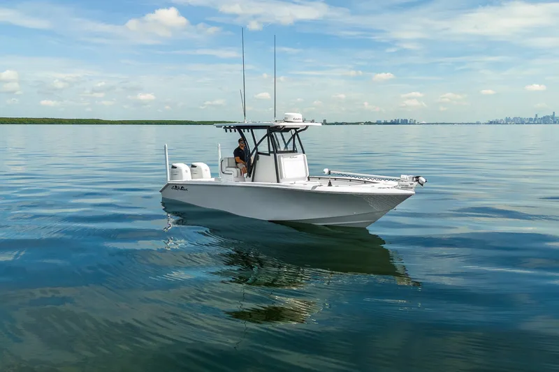 The Image of 2024 SeaHunter 28 Floridian boat cruising on calm waters under a clear sky. - 1