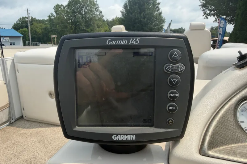 Slide: The Image of Garmin 145 fishfinder on 2008 Crest 25 II XRS boat dashboard, outdoors. - 21