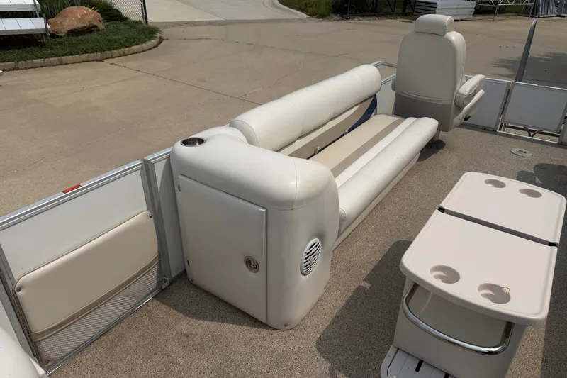 Slide: The Image of 2008 Crest 25 II XRS boat interior with beige seating and table. - 13