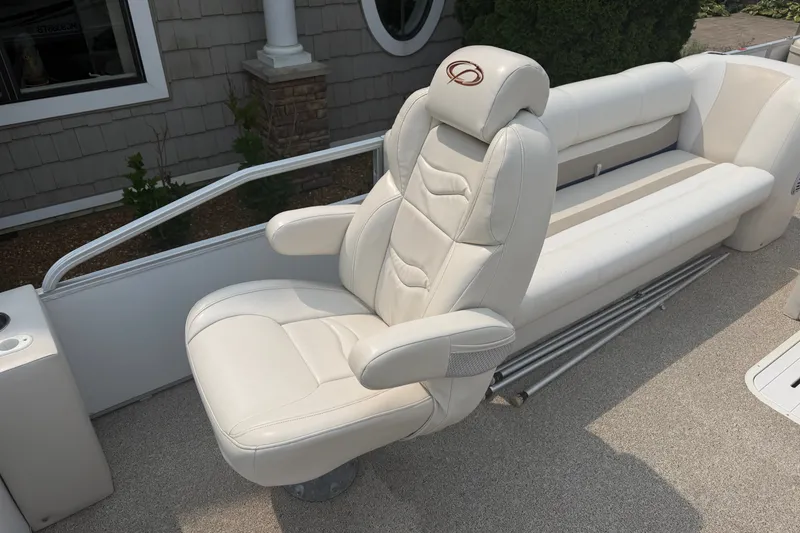 Slide: The Image of Luxurious seating on a 2008 Crest 25 II XRS boat, featuring plush white upholstery. - 5