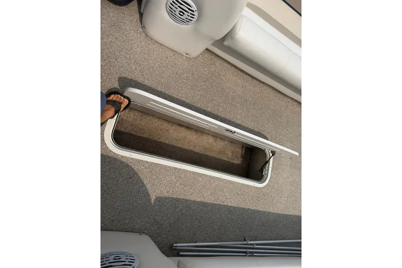 Slide: The Image of Open storage compartment on 2008 Crest 25 II XRS boat deck. - 10