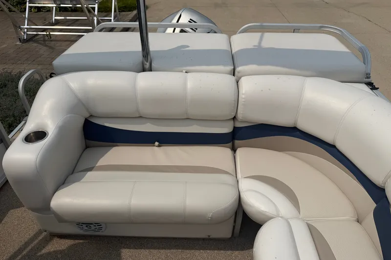 Slide: The Image of 2008 Crest 25 II XRS boat interior with white and blue cushioned seating. - 23