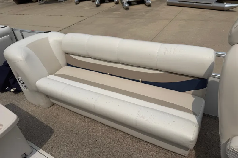 Slide: The Image of 2008 Crest 25 II XRS boat seat with beige and blue upholstery on deck. - 8