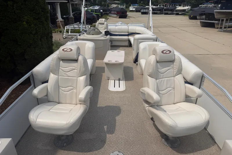 Slide: The Image of 2008 Crest 25 II XRS boat interior with plush white seating and spacious layout. - 3
