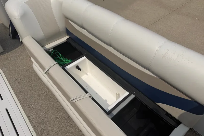 Slide: The Image of Crest 25 II XRS 2008 boat interior with open storage compartment and seating. - 11