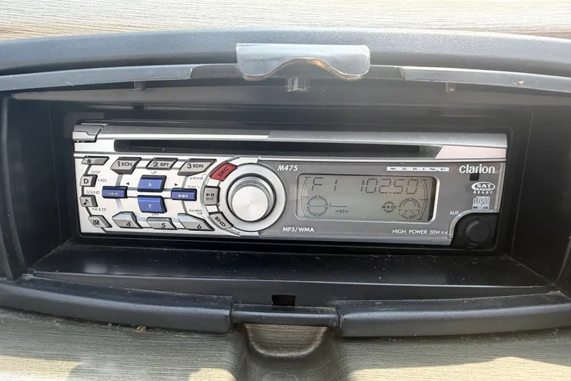 Slide: The Image of Clarion marine stereo system in a 2008 Crest 25 II XRS boat dashboard. - 22