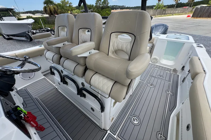 Slide: The Image of 2017 Sea Fox 328 Commander boat interior with beige seating and sleek design. - 32