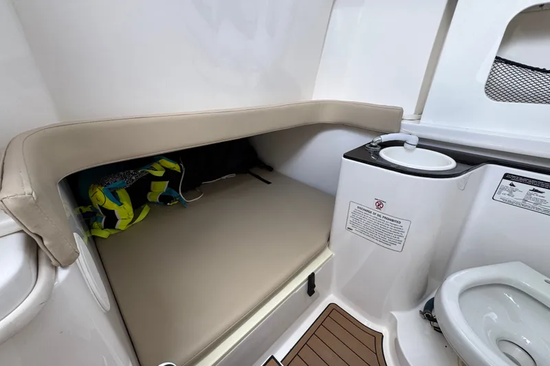 Slide: The Image of 2017 Sea Fox 328 Commander cabin with seating and compact toilet area. - 29
