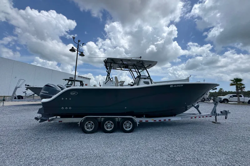 Slide: The Image of 2017 Sea Fox 328 Commander boat on trailer under cloudy sky. - 12