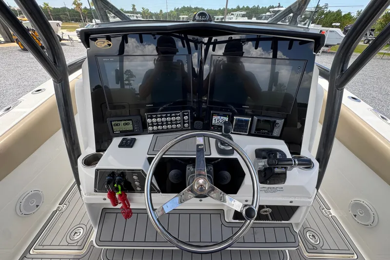 Slide: The Image of 2017 Sea Fox 328 Commander boat dashboard with steering wheel and electronic controls. - 37