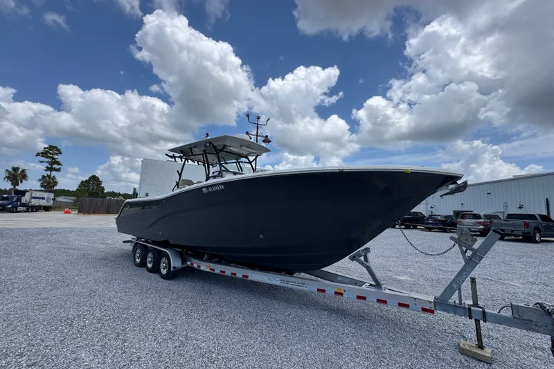 Slide: The Image of 2017 Sea Fox 328 Commander boat on trailer under cloudy sky. - 9