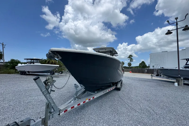 Slide: The Image of 2017 Sea Fox 328 Commander boat on trailer under blue sky with clouds. - 6