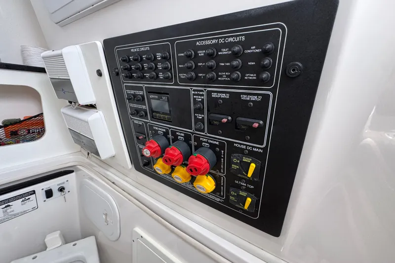 Slide: The Image of Control panel of a 2017 Sea Fox 328 Commander boat with various switches and dials. - 31