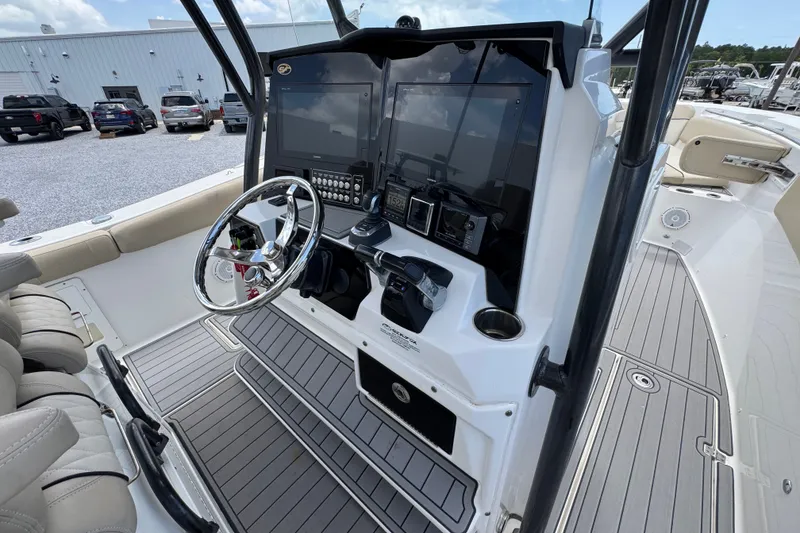 Slide: The Image of 2017 Sea Fox 328 Commander boat cockpit with steering wheel and navigation controls. - 42