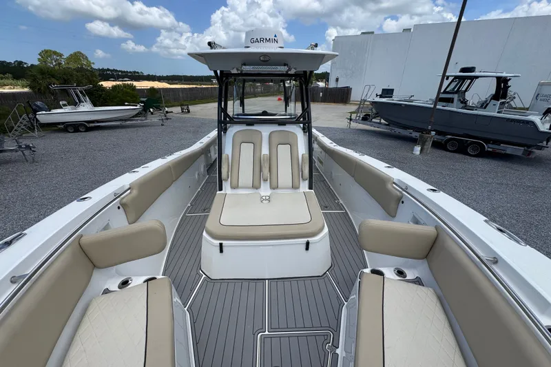 Slide: The Image of 2017 Sea Fox 328 Commander boat interior with beige seating and Garmin equipment. - 26