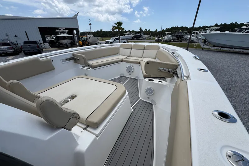 Slide: The Image of 2017 Sea Fox 328 Commander boat interior with beige seating and spacious deck. - 21