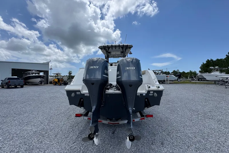 Slide: The Image of 2017 Sea Fox 328 Commander with dual Yamaha 300 engines in a boatyard setting. - 17