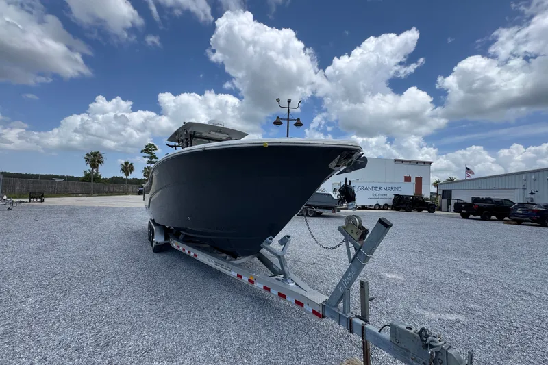 Slide: The Image of 2017 Sea Fox 328 Commander boat on trailer under a cloudy sky at Grander Marine. - 8