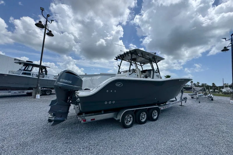 Slide: The Image of 2017 Sea Fox 328 Commander boat on trailer under cloudy sky. - 14