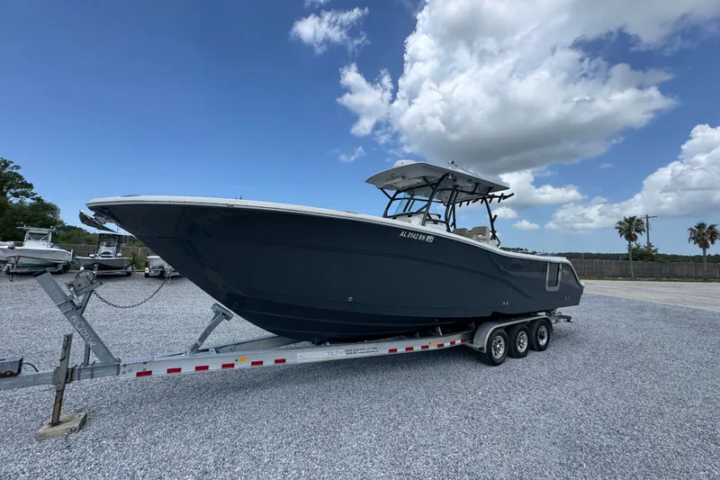 Slide: The Image of 2017 Sea Fox 328 Commander boat on trailer under blue sky. - 4