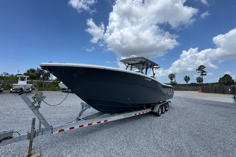 Slide: The Image of 2017 Sea Fox 328 Commander boat on trailer under blue sky. - 5