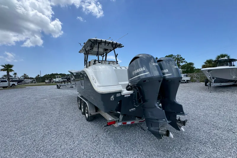 Slide: The Image of 2017 Sea Fox 328 Commander boat with dual Yamaha engines on a trailer. - 19