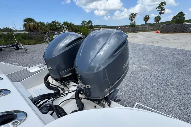 Slide: The Image of Twin Yamaha outboard engines on a 2017 Sea Fox 328 Commander boat, parked outdoors. - 51