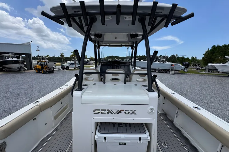 Slide: The Image of 2017 Sea Fox 328 Commander boat with Yeti cooler, docked outdoors. - 44